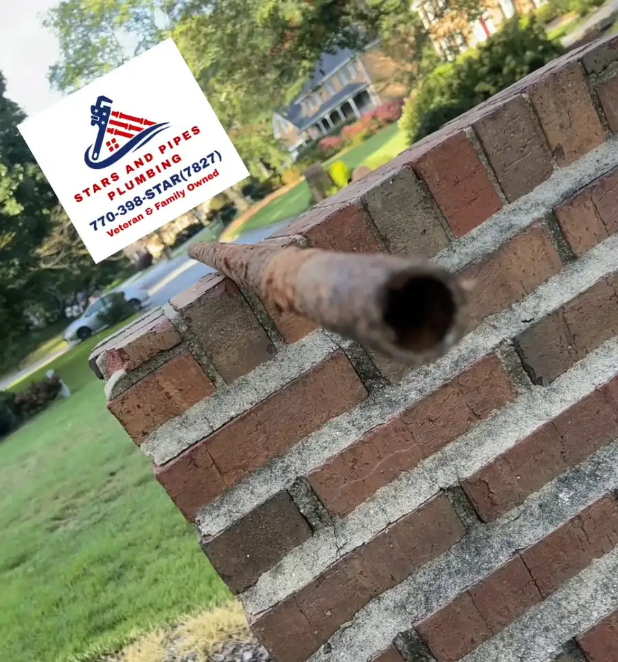 Stars and Pipes Plumbing Atlanta repairing an exterior water line leak in a Lilburn, GA front yard
