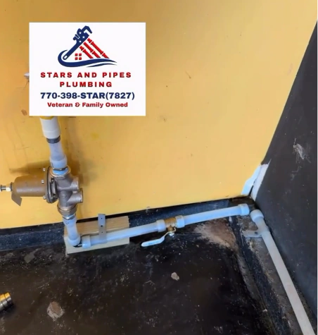 Inside the garage: the new main shutoff valve and pressure regulator where the line enters the home.