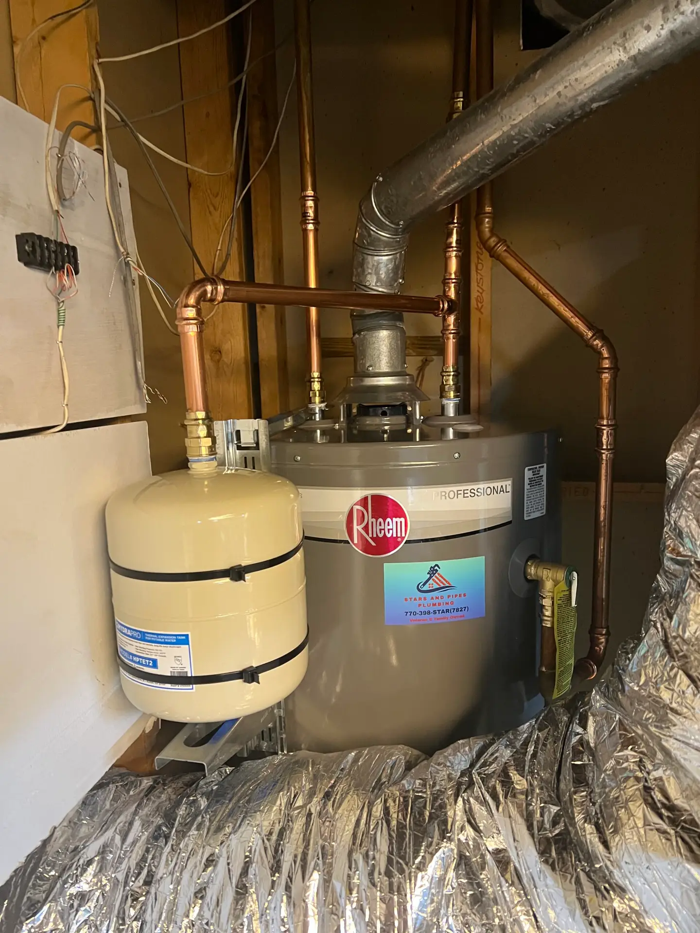 Rheem Professional water heater with thermal expansion tank installed by Stars and Pipes Plumbing Atlanta
